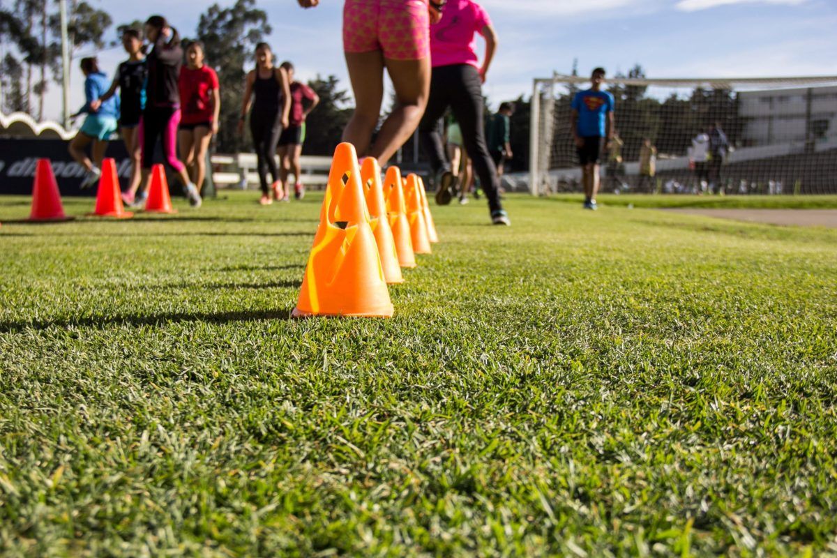Footballers running conditioning drills during pre-season